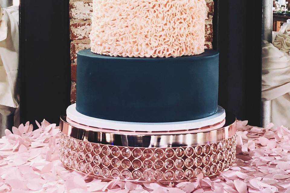 Navy and rose gold wedding cak