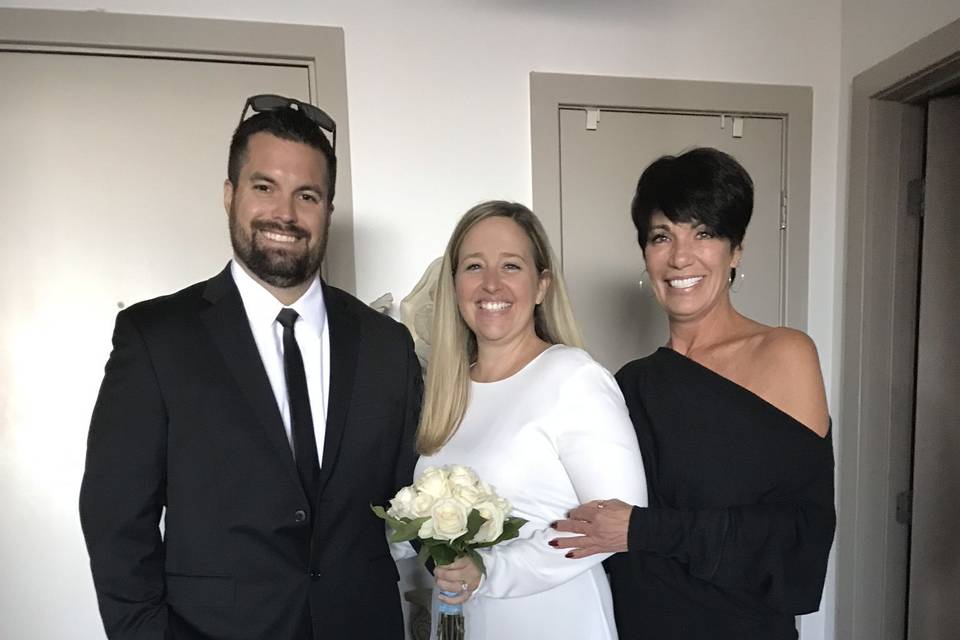 Officiant with the newlywed couple