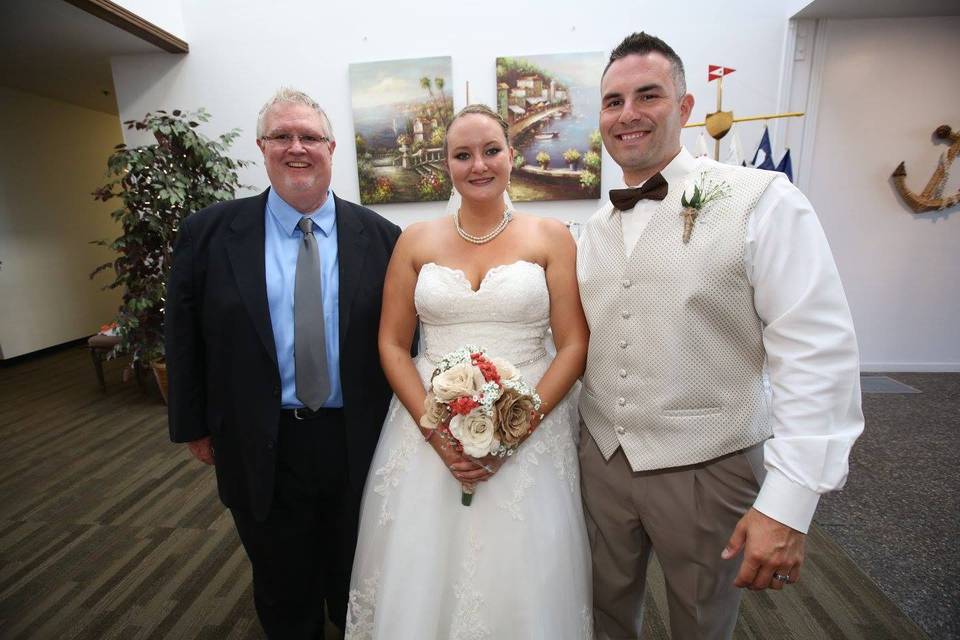 Officiant photo with the newlyweds