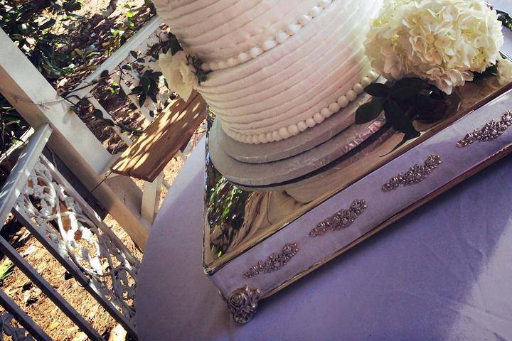 4-tier wedding cake with white flowers