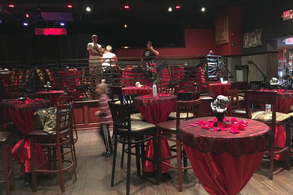View of the dance floor and upper bar area - both used here for guest seating.