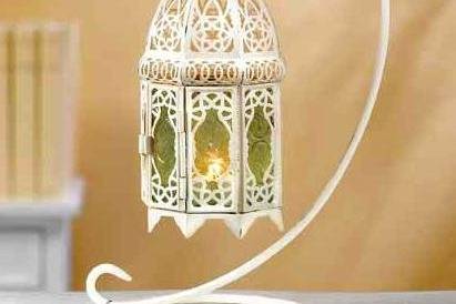 White Ivory and Crystal Elegant Candelabra - Dripping with glittering crystals, graceful ivory curlicues create a showy support for a trio of candles. Delightfully extravagant with a touch of Old World elegance! Very romantic! Metal and acrylic. Candles not included. 16 1/4