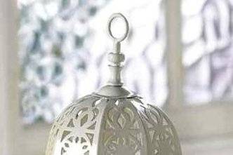 Fancy White Candle Lantern with Stand - The glow of a tealight through the pale green glass panes and the charming lattice designed cutouts of the shell add a romantic aura to any setting. Hang the lantern on the accompanying stand for heightened effect! Tealight only (not included). Metal and glass. Lantern: 4