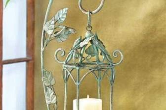Iron Lattice Moroccan Candle Lantern & Stand - Create a romantic evening garden by capturing the drama of a deep desert night with this enchanting standing lamp! Free swinging lattice lantern cage lets candlelight create shifting designs that dazzle and delight. Weight 4.6 lbs. Iron. (Candle not included.) 11 1/4