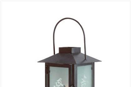 your favorite pillar candle adds warmth and light when placed within. Weathered verdigris finish lends the appearance of time worn copper. Wrought iron. (Pillar candle not included.) 8