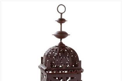 Arabian Style Weathered Copper Finish Candle Lantern - Candlelight takes on an intriguing amber glow as it shines from the center of this Arabian style lantern, bringing to mind fascinating tales of adventure and the romance of the warm desert nights. Weathered copper finish highlights every facet of this handsome candle lamp's alluring silhouette. Iron and glass. Candle not included. 5 7/8