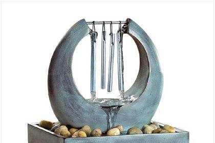 Scrolled Iron Votive Holder - Crystal clear glass votive cups dangle from curvy metal scrollwork in a fountain of flickering light. Just the right touch of sparkle for a relaxing, romantic night! Metal with glass cups. Votive candles not included. 11
