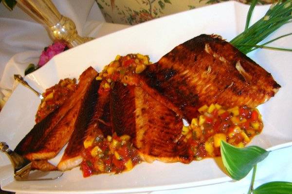 Flaky grilled Salmon and braised in Apricot Sauce to seal the moisture.  Served with Mango Salsa.