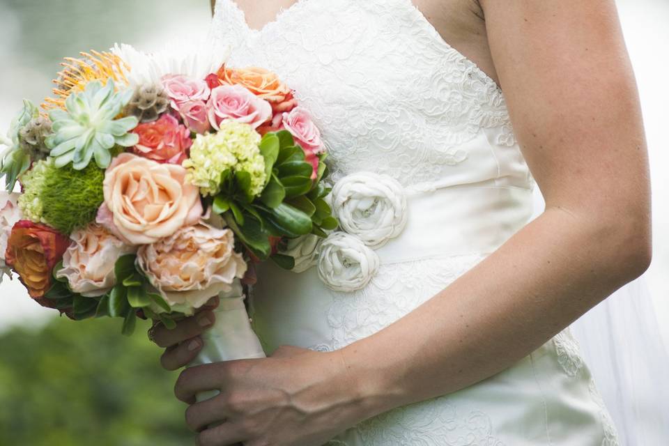 Happy bride with her bouquet