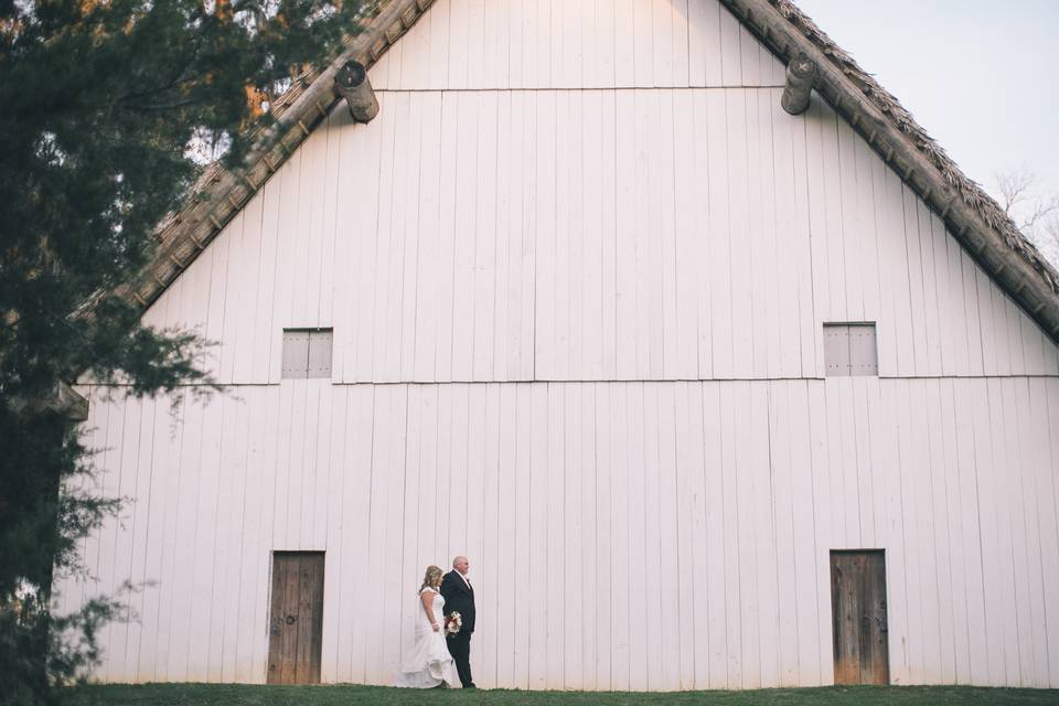 Newlyweds outside the barn