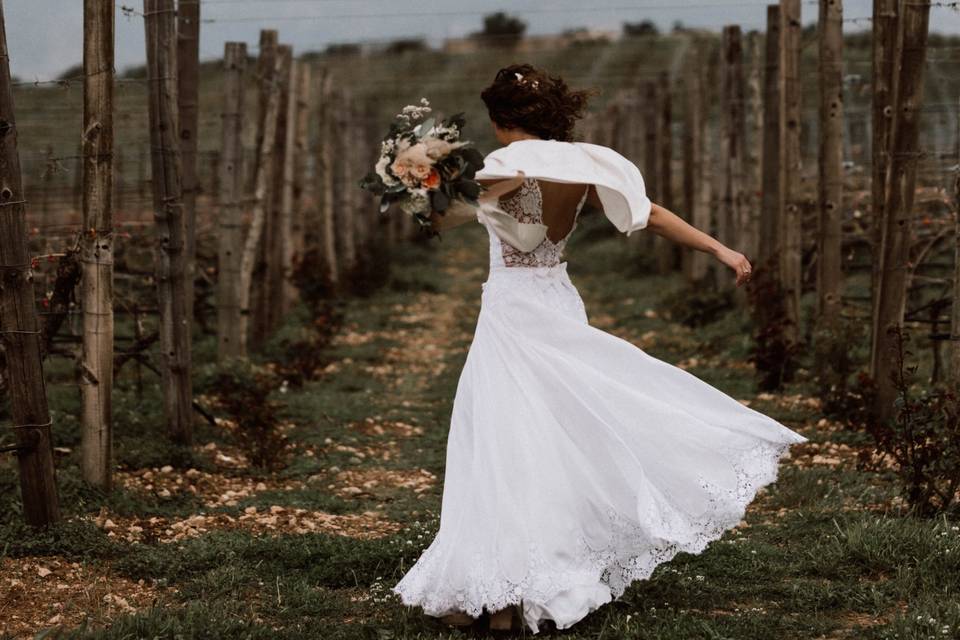 Bride dancing in the vineyards