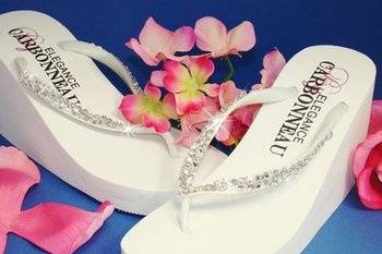 White/Crystal High Wedge Flip Flops
Elegant high wedge special occasion bridal flip flops with a double row of crystal accents. The flip flops feature a stunning 3-1/2
