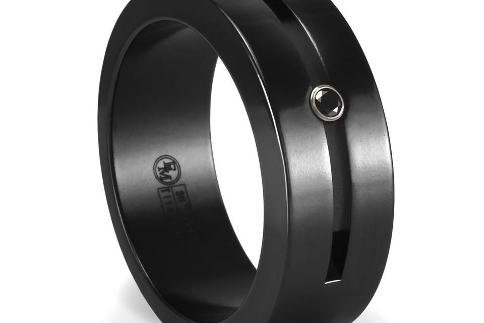 Ultra Modern. Contemporary design. Black Titanium. Black Diamond. This black titanium ring has a black diamond set in a white gold bezel set smack in the middle of the center groove.