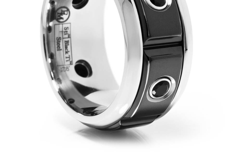 This Bold 11mm wide band is the epitome of what a masculine ring looks like. The ring is Stainless steel with a black titanium inlay and jet black spinel going all the way around the ring. If your looking for a masculine design, look no further!