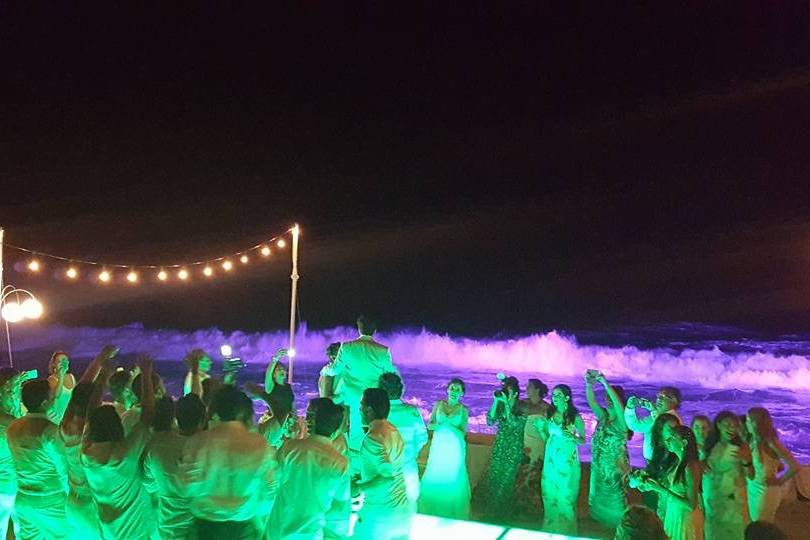 Illuminated dance floor, string lights and Colorful lighting for the sea