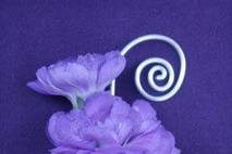 Boutonnieres for the groomsmen & fathers, lavender mini-carnations.