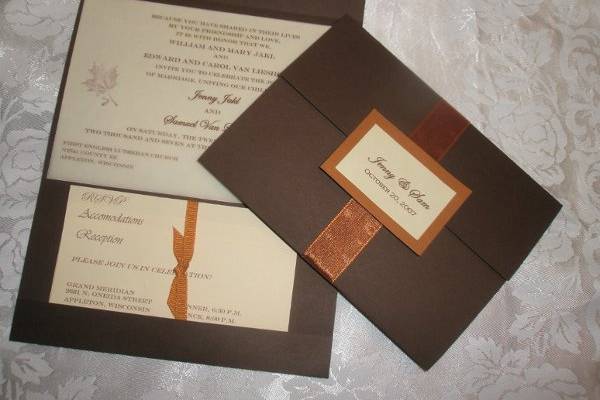 This rich chocolate brown invitation is graced with a rust ribbon and bronze and ivory seal.  Inside, the RSVP, Reception & Accomodations Cards are secured with coordinating deep gold ribbon.