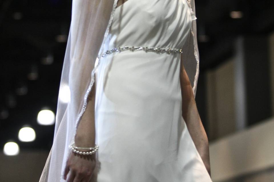 Classic White single tier floor length veil with white pearls and swarovski crystal beading over organza edging.