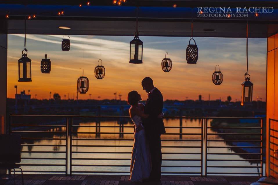 Rooftop wedding downtown Tampa. Photo courtesy of Regina Rached Photography. Floral by 2Birds Events﻿.
