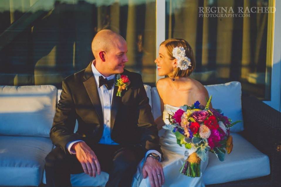 Rooftop wedding downtown Tampa. Photo courtesy of Regina Rached Photography. Floral by 2Birds Events﻿.