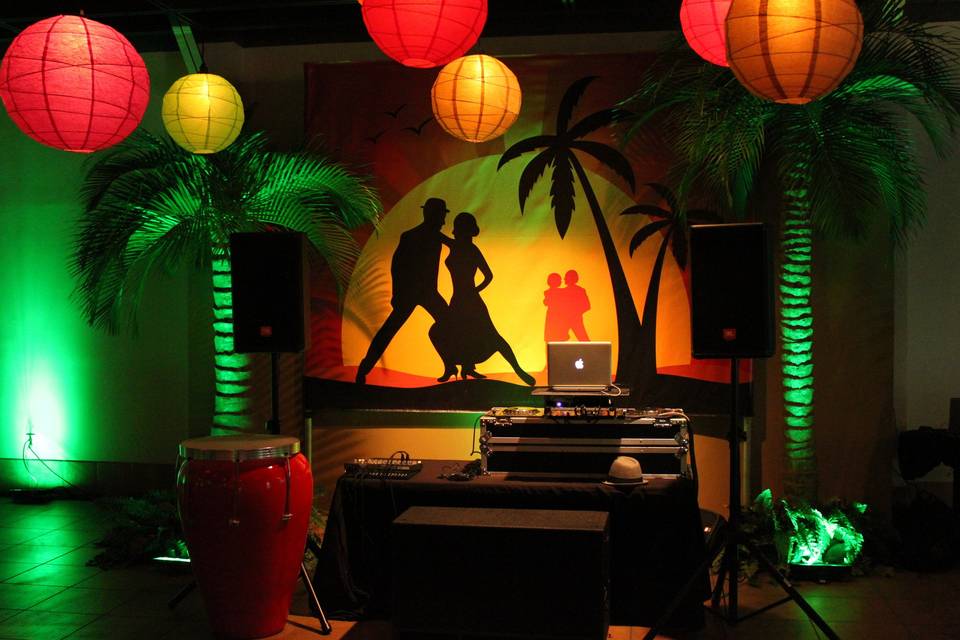 Miami themed wedding reception in a museum with LED uplighting, illuminated globes, and custom backdrop.