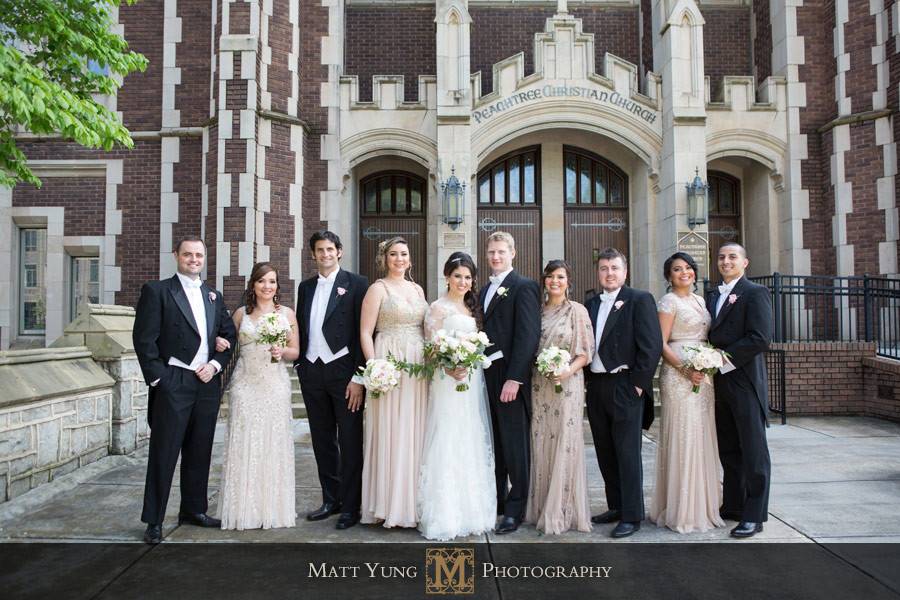 The couple with the bridesmaids and groomsmen