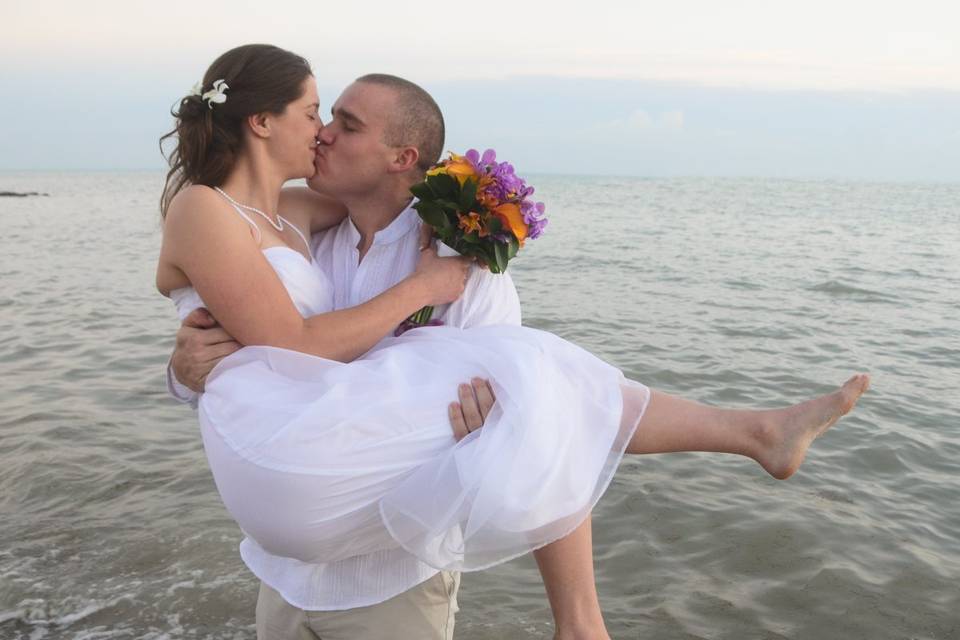 Groom Picking up Bride