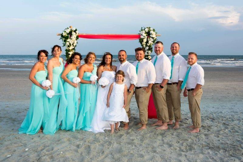 The couple with the bridesmaids and groomsmen