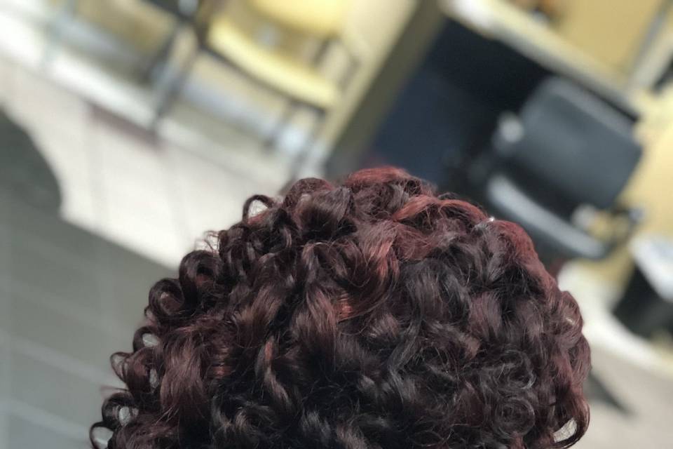Side view of corkscrew curls