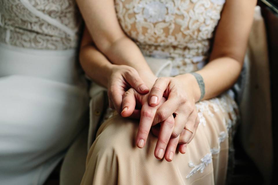 Brides holding hands.