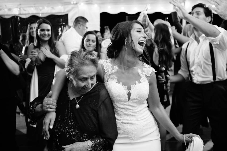 Bride dances with grandmother.