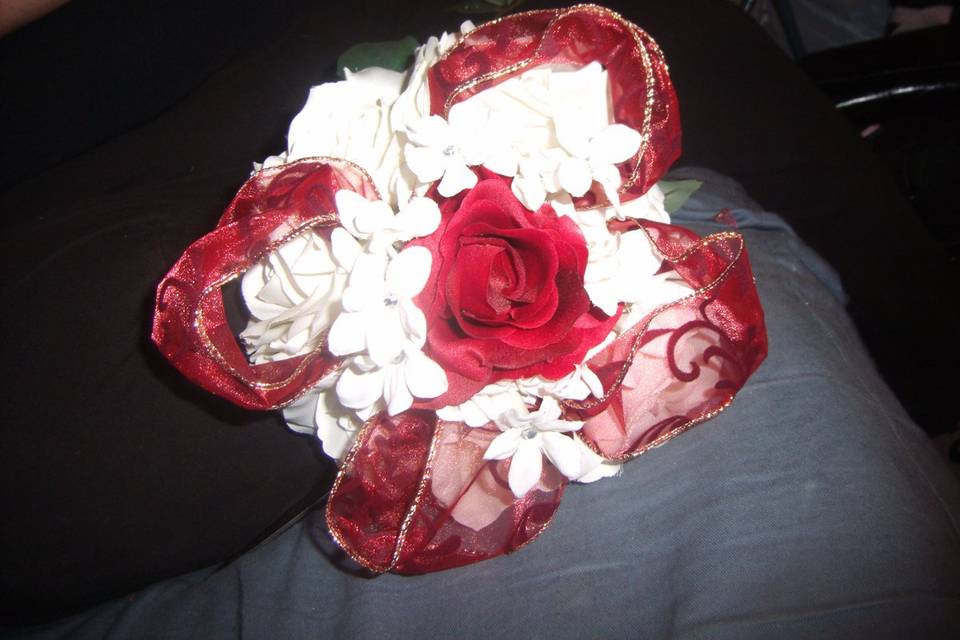 Red rose with white flowers