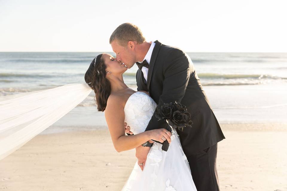 Couple kissing on the beach