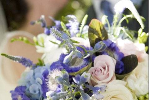 Outdoor wedding at Appleford. Mixed bouquet of roses, hydrangea, scabiosa, delphinium, veronica and foliage.