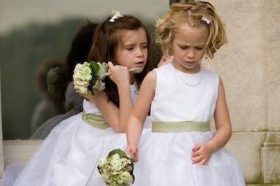 Precious flower girls with small bouquets