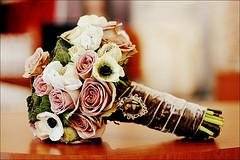Old fashioned roses with velvet ribbon and a camio to complete this wintery look.