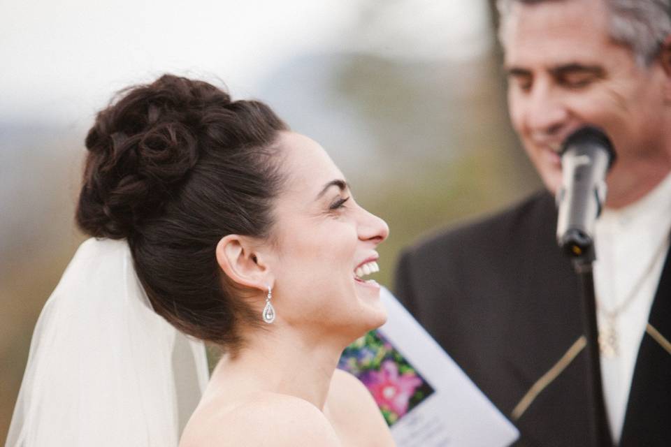 A happy bride states her vows to her betrothed