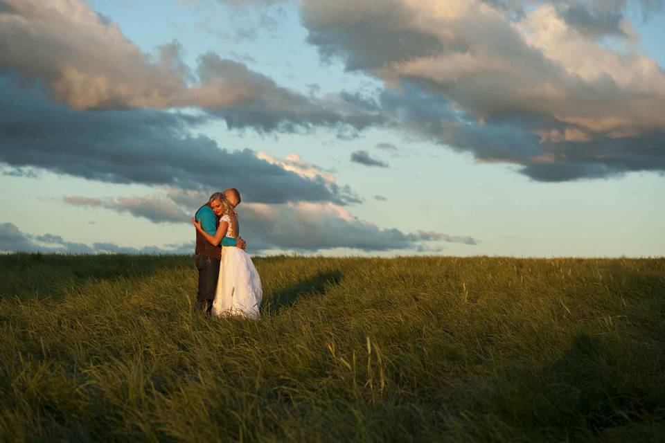 Stormy sky over newlyweds. Country wedding at family farm near Portland Oregon