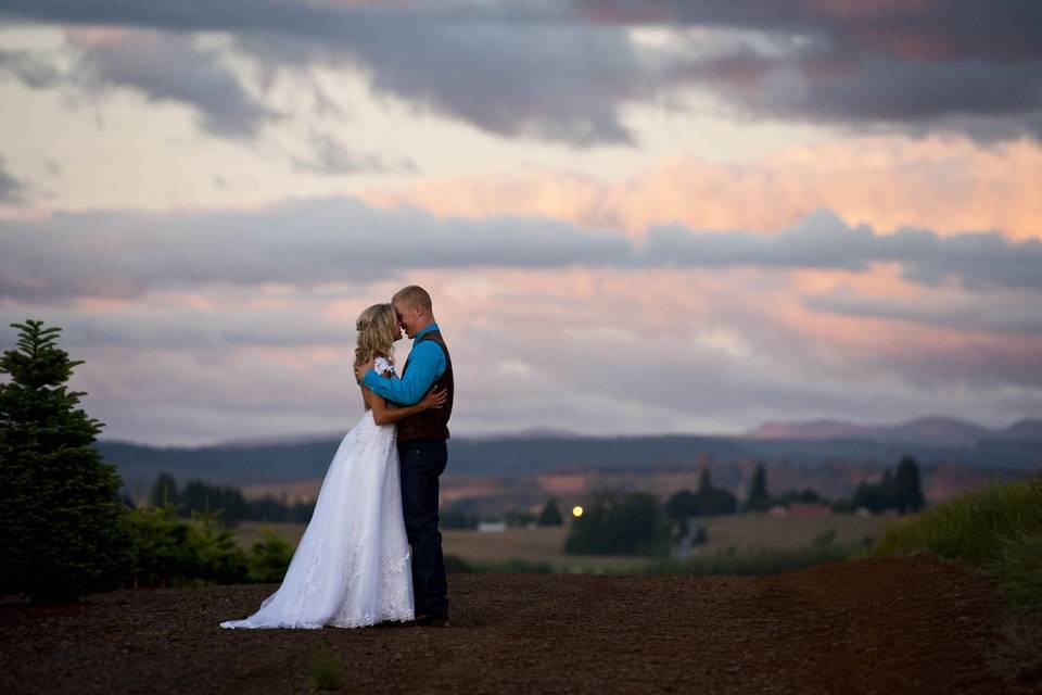 Newlyweds at sunset.Country wedding at family farm near Portland Oregon