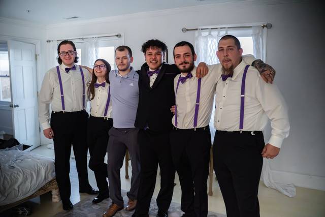Groomsmen embracing