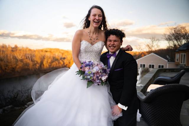 Bride and groom cliffside rive