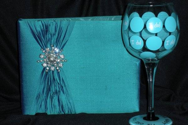 Blue wedding invite and wine glass