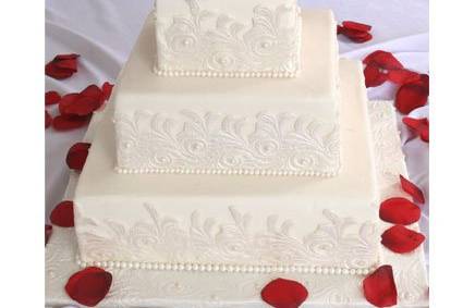 Tiered square fondant cake with fondant lace pattern and fondant pearls.