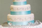 Fondant tiered cake with silver scrolls and bling ring topper