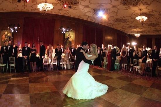 The couple shares their first dance among family and friends at the Bohemian Club in San Francisco.
