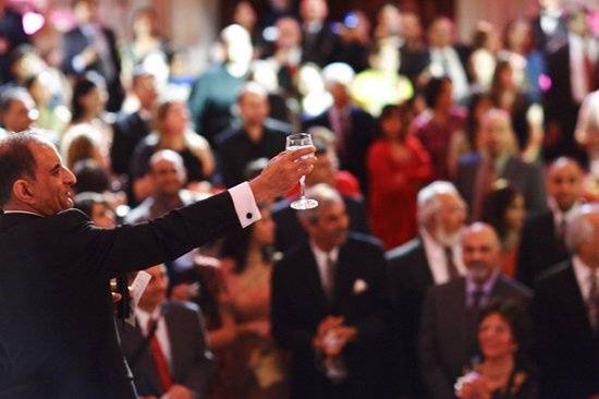 The father of the groom toast the guest during a Valima celebration at San Francisco's City Hall Rotunda.