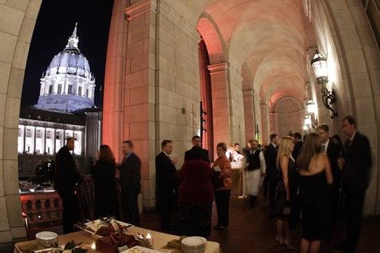 Guest enjoy the cocktail reception at the Green Room balcony, located on the 2nd floor of the Veterans Building in San Francisco, with a beautiful backdrop of San Francisco's City Hall.