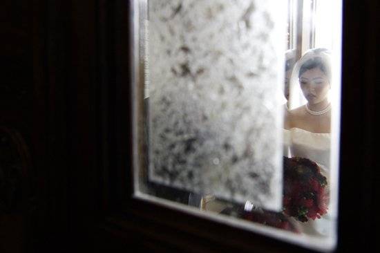 The bride takes a moment to herself before the door opens during the start of the ceremony.