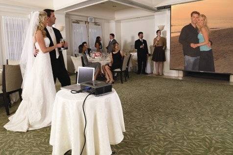 Turn your photo montage into a big screen experience with a projector rental.