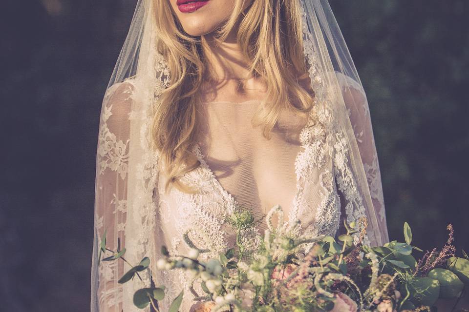 Gorgeous bride holding her bouquet